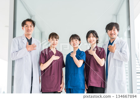 Medical workers in scrubs, medical staff, female nurses and male doctors in white coats Medical workers in scrubs, medical staff, female nurses and male doctors in white coats 134667894