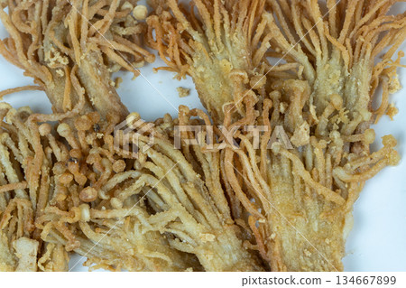 Crispy Fried Enoki Mushrooms on White Ceramic Plate Crispy Fried Enoki Mushrooms on White Ceramic Plate 134667899