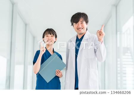 Medical workers in scrubs, medical staff, female nurses and male doctors in white coats Medical workers in scrubs, medical staff, female nurses and male doctors in white coats 134668206