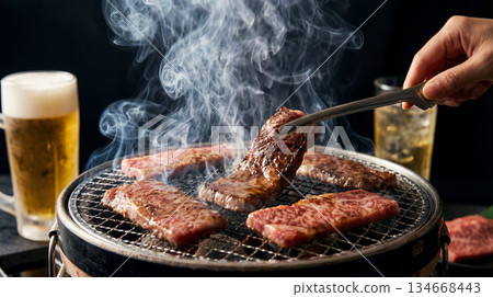 Smoky charcoal grilled meat and cold beer: a mouthwatering Japanese dining scene 134668443