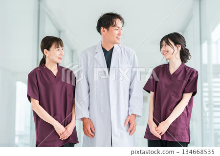 Medical workers in scrubs, medical staff, female nurses and male doctors in white coats Medical workers in scrubs, medical staff, female nurses and male doctors in white coats 134668535