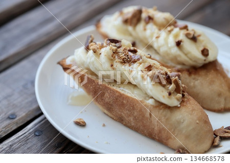 Banana and mixed nuts tartine, baguette open sandwich 134668578