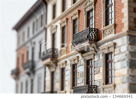 Detailed facade of historic european building with stone and brick elements 134669341