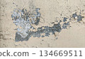 weathered beige wall with exposed concrete and erosion 134669511