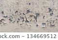 weathered wall with exposed concrete and chipped paint 134669512