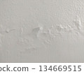 bubbling paint damage on interior white wall 134669515