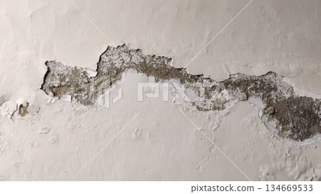 damaged wall surface showing flaking and erosion 134669533