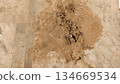 dried mud patch on marble floor surface 134669534