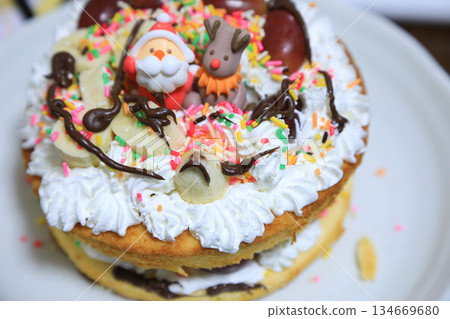 Homemade Christmas cake made by kids Homemade Christmas cake made by kids 134669680