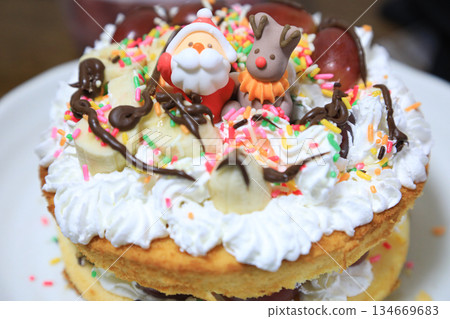 Kids baking Christmas cake Kids baking Christmas cake 134669683