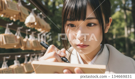 A woman writing a votive tablet 134669831