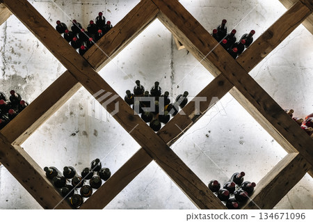 Modern Wine Cellar Display with Wooden Grid and Backlighting 134671096