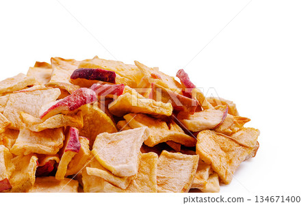Healthy snack of crunchy apple chips in a tasty pile on a clean background Healthy snack of crunchy apple chips in a tasty pile on a clean background 134671400