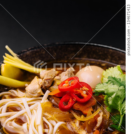 Delicious bowl of ramen featuring fresh ingredients and rich broth 134671413
