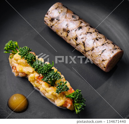 Gourmet dish featuring elegant presentation of meat and vegetables Gourmet dish featuring elegant presentation of meat and vegetables 134671440