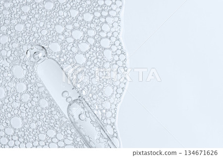 The texture of the foam of shower gel or soap suds or shaving foam. Macrophotography. Copy space 134671626