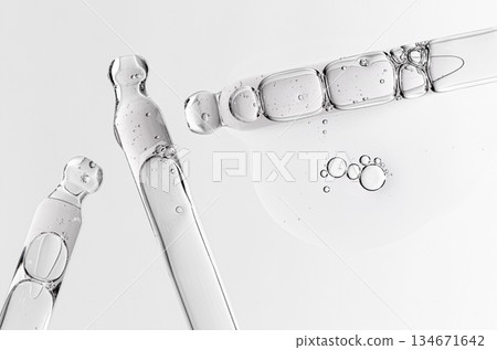 Skin serum in a pipette. A cosmetic product for body care. White background. Skin serum in a pipette. A cosmetic product for body care. White background. 134671642