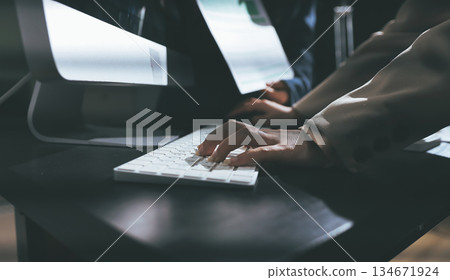 Close up high angle Asian businesswoman working with her coworker in meeting room 134671924