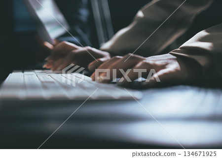 Close up high angle Asian businesswoman working with her coworker in meeting room 134671925