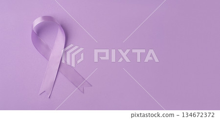 Lilac ribbon on purple background. 134672372