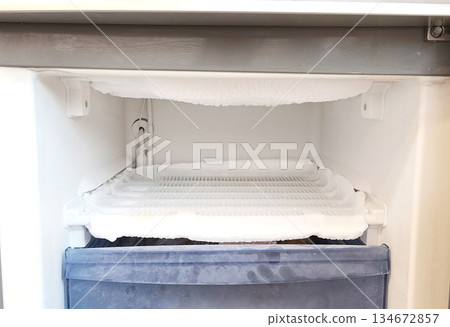 freezer drawer is open, a thick layer of ice is visible on the cooling element. Defrosting mode is not followed and the refrigerator's efficiency is reduced. freezer drawer is open, a thick layer of ice is visible on the cooling element. Defrosting mode is not followed and the refrigerator's efficiency is reduced. 134672857