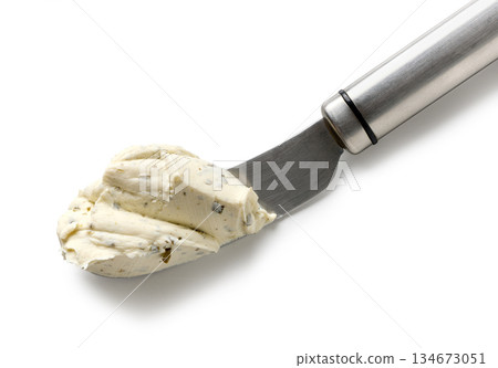 fresh cream cheese on a knife fresh cream cheese on a knife 134673051