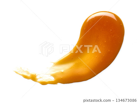 caramel sauce isolated on white background caramel sauce isolated on white background 134673086