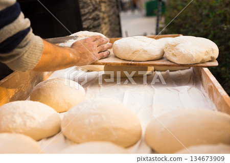 bread preparation. loaves of dough before baking 134673909