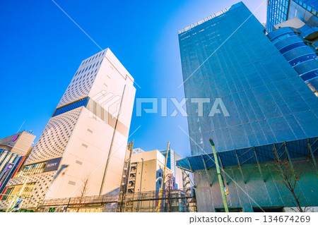End of the year cityscape of Tokyo, Japan. Ginza Core Reconstruction Project new construction work and World Town Building renovation work. On the left is Ginza Place 134674269