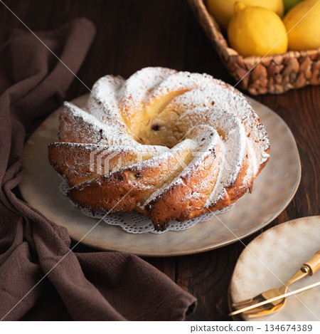 Lemon bundt cake powdered sugar on wooden table 134674389
