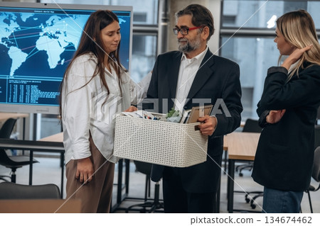 Goodbye, employee is fired. Group of office workers are indoors together 134674462