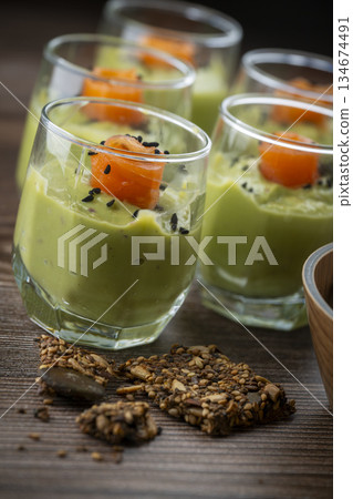 Smoked salmon shot glasses guacamole served with homemade crackers Smoked salmon shot glasses guacamole served with homemade crackers 134674491
