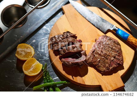 Family shares a meal of grilled meat and vegetables during iftar gathering in Ramadan evening Family shares a meal of grilled meat and vegetables during iftar gathering in Ramadan evening 134674682