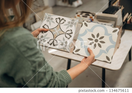 Plate for kitchen. Close up view of woman that is in the hardware store 134675611