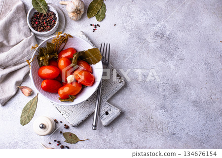Marinated pickled tomatoes in jar Marinated pickled tomatoes in jar 134676154