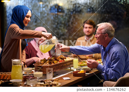 Family gathers for iftar meal during Ramadan celebration with joyful moments and shared food experiences 134676262