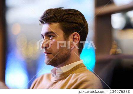 Gathering around the table for iftar during Ramadan with family sharing food and stories in a cozy atmosphere 134676288