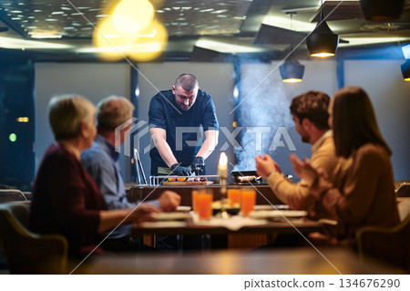 Gathering around iftar with family and friends during Ramadan at a lively restaurant Gathering around iftar with family and friends during Ramadan at a lively restaurant 134676290