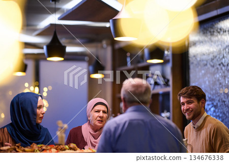 Family gathers for iftar while enjoying Ramadan traditions and sharing stories in a cozy setting 134676338