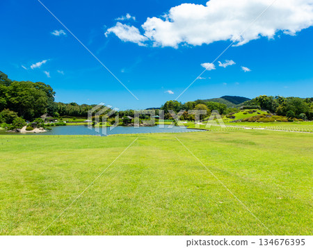 Summer in Okayama: Refreshing scenery of Korakuen Garden, a vast lawn and a pond Summer in Okayama: Refreshing scenery of Korakuen Garden, a vast lawn and a pond 134676395