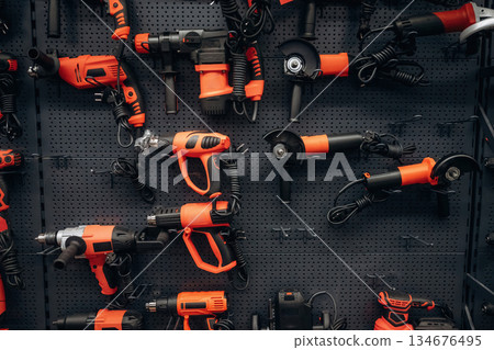 Bunch of circular saws on the wall in the hardware store 134676495