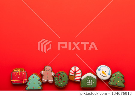 Christmas gingerbread cookies on red background copy space Christmas gingerbread cookies on red background copy space 134676913