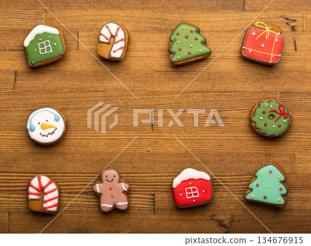 Festive iced gingerbread cookie assortment on wooden table Festive iced gingerbread cookie assortment on wooden table 134676915