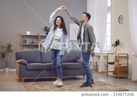 Happy Young Family Couple Dancing At Home Happy Young Family Couple Dancing At Home 134677208