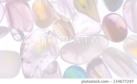 Transparent pale gemstones and crystal sparkles on a white background. A stylish texture background for women. Transparent pale gemstones and crystal sparkles on a white background. A stylish texture background for women. 134677297