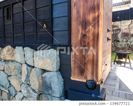 Refreshing summer scenery of Matsumoto Castle: The solemn stone walls of the Taikomon Gate 134677721