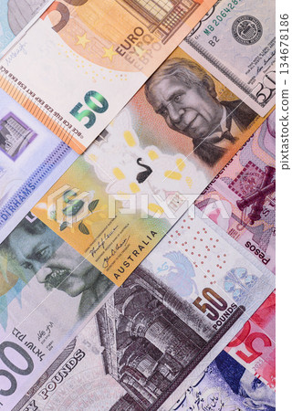 Paper money, banknotes of different countries as a business background. Paper money and cash Paper money, banknotes of different countries as a business background. Paper money and cash 134678186
