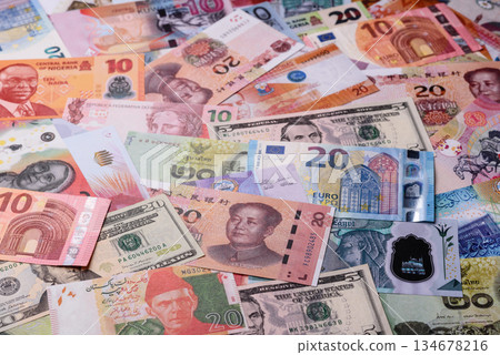 Paper money, banknotes of different countries as a business background. Paper money and cash Paper money, banknotes of different countries as a business background. Paper money and cash 134678216