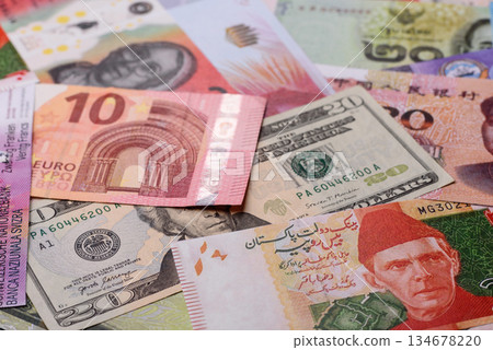 Paper money, banknotes of different countries as a business background. Paper money and cash Paper money, banknotes of different countries as a business background. Paper money and cash 134678220