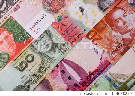 Paper money, banknotes of different countries as a business background. Paper money and cash 134678239
